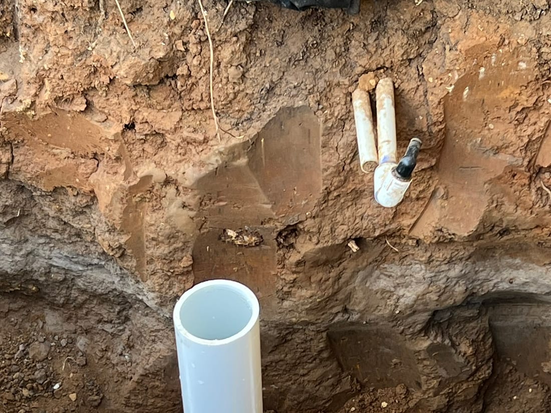 Close-up of primed and glued PVC fittings by Encore Plumbing