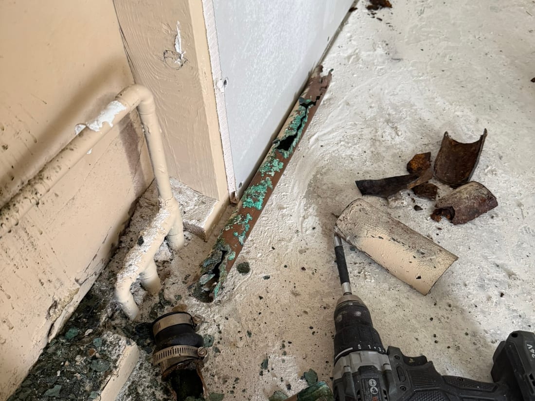 Corroded cast-iron drain cut out at the slab by Encore Plumbing, Arlington