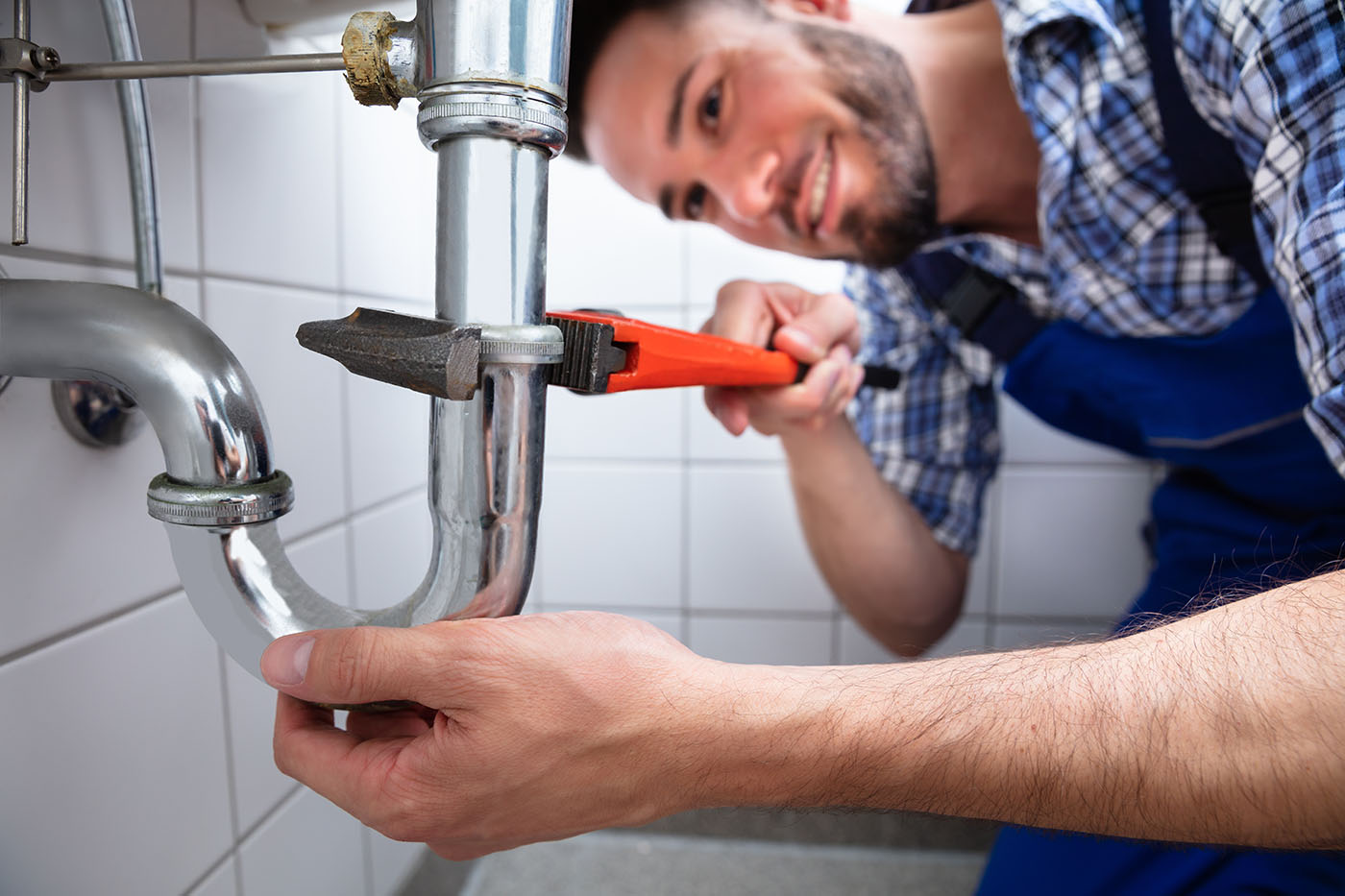Leak Detection - Plumber fixing a pipe