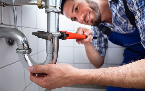 Leak Detection - Plumber fixing a pipe